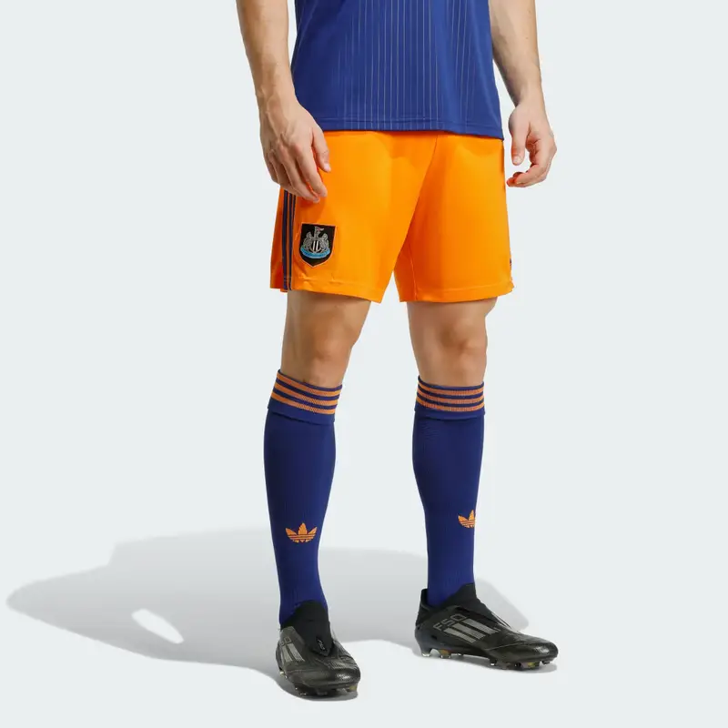 Pantaloncini a tre quarti Newcastle United FC 25/26 Bahia Orange