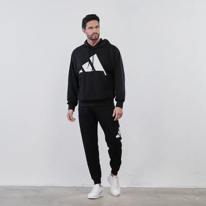 Pantaloni neri sportivi da uomo con maxi logo e polsini