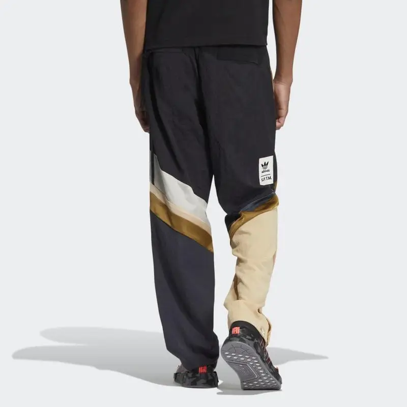 Pantaloni sportivi dritti in maglia Adidas Originals SFTM co-branded con stampa logo a righe Uomo Fondi IA9331 XXS miniatura 3