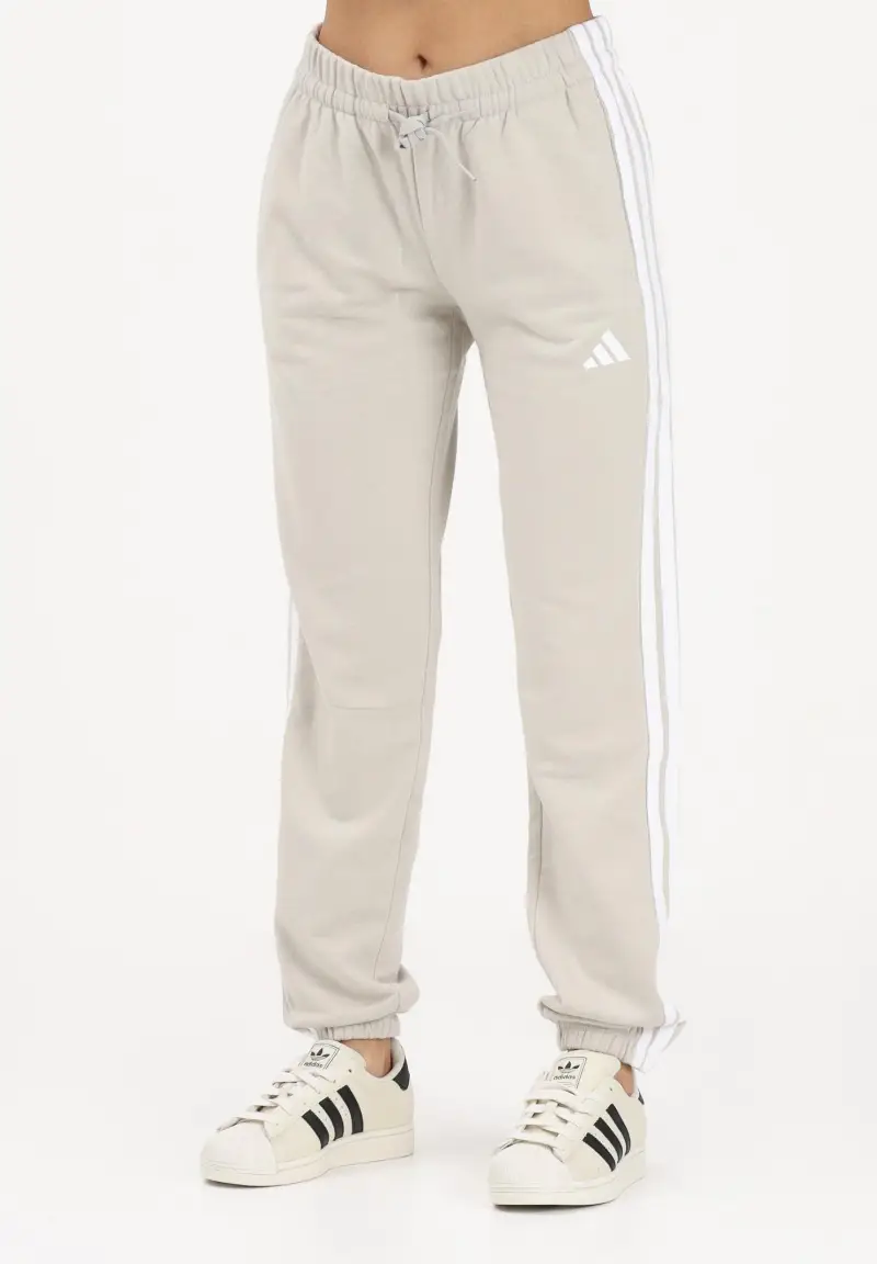 Pantalone sportivo Essentials 3-Stripes French Terry Cuffed beige da donna
