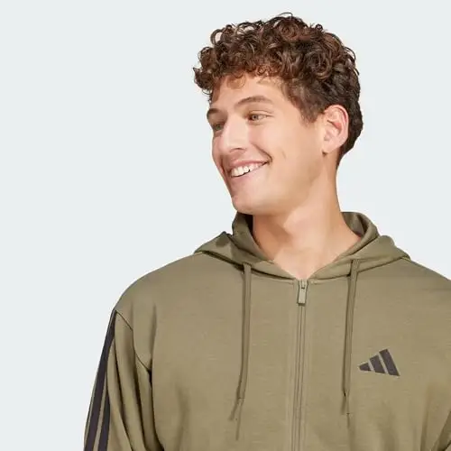 adidas Uomo Essential Three Stripes French Terry Fullzip Hoodie, Olive Strata/Black, S miniatura 2