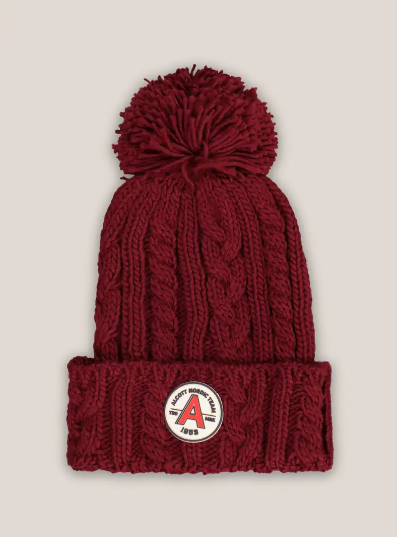 Cappello con pon pon e patch