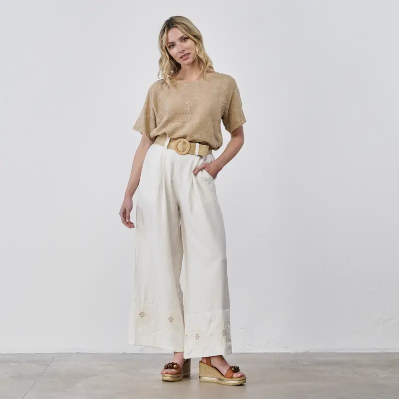 Pantaloni lunghi ampi beige da donna con orlo ricamato