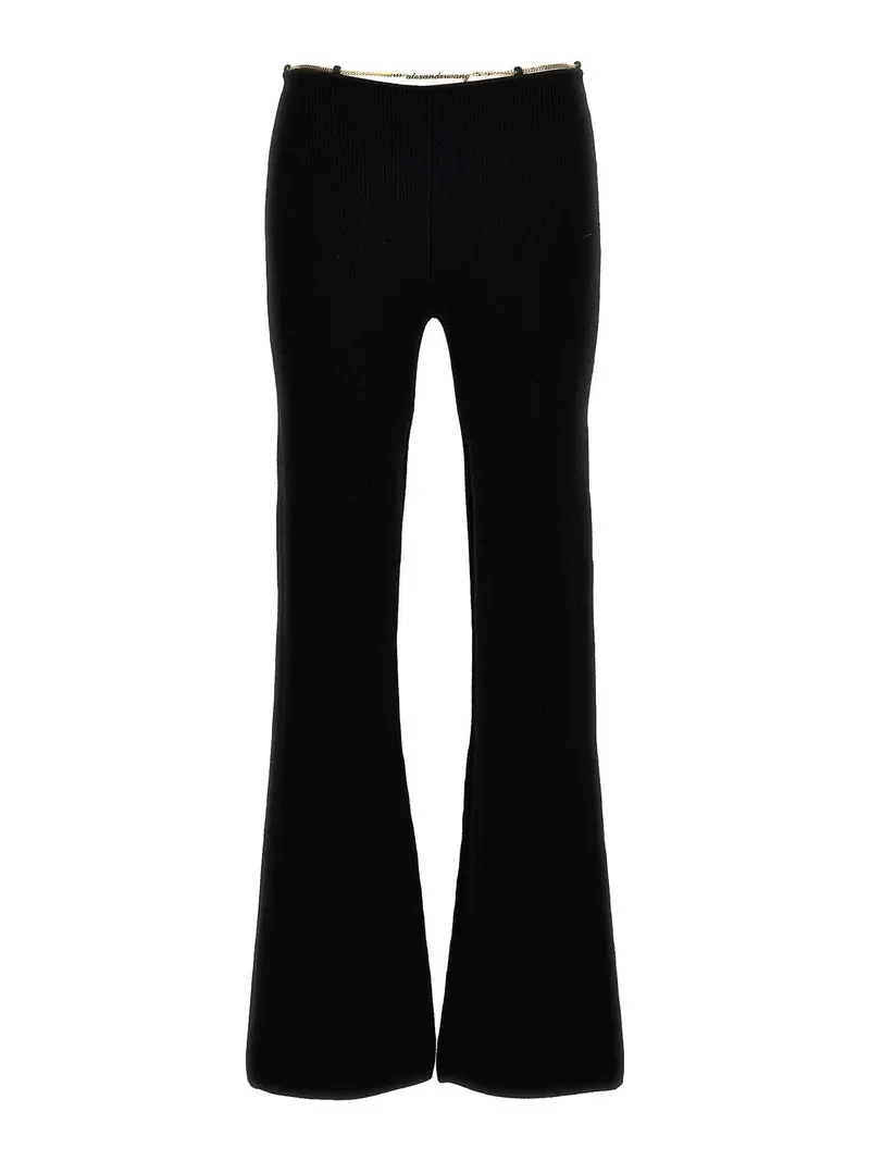 Pantaloni con catena con targhetta dorata Nero