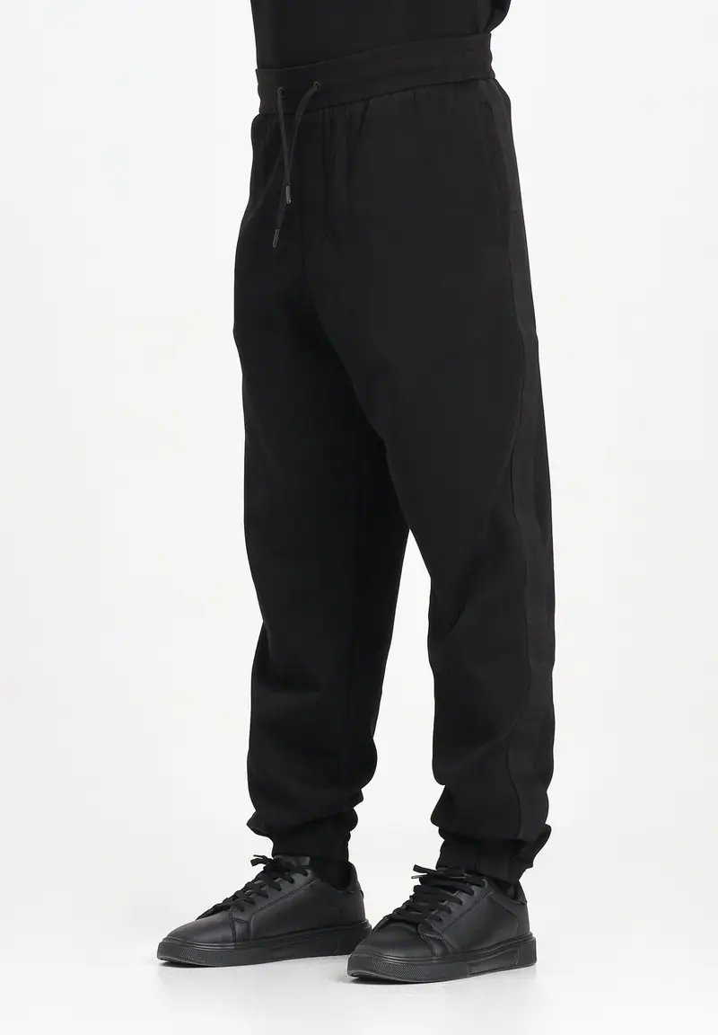 Pantalone sportivo nero da uomo con bande laterali logate