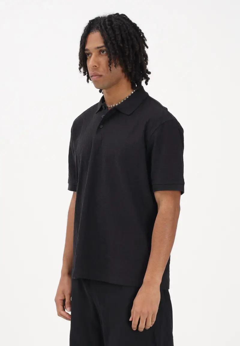 Polo a manica corta nera da uomo con logo all-over