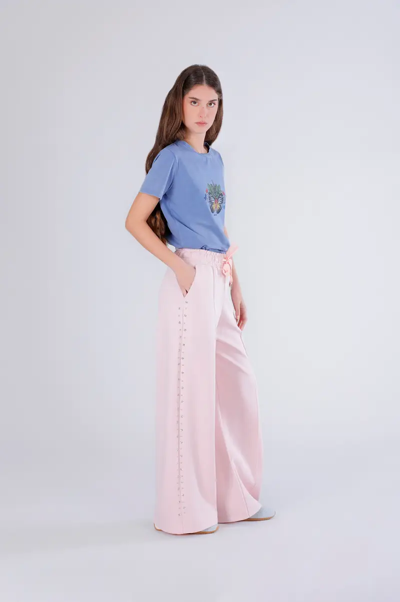 pantaloni palazzo con applicazione rosa