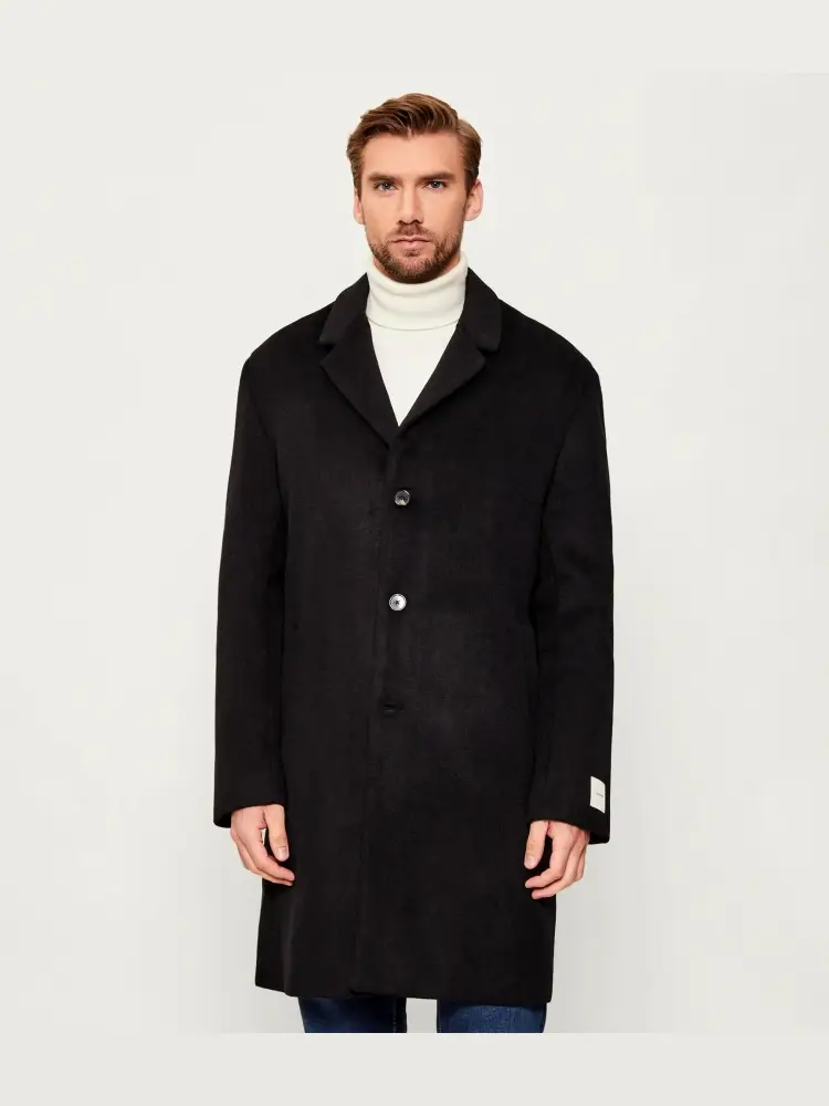 cappotto nero uomo logo sul retro