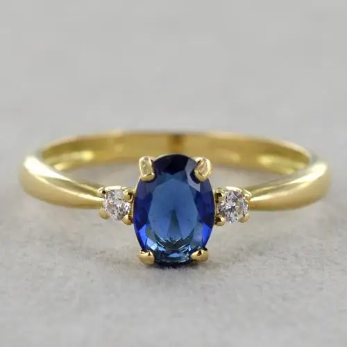 anello in oro giallo con zircone ovale blu e zirconi bianchi miniatura 5