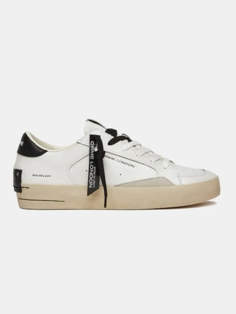 scarpe bianche uomo dettagli neri logo sul lato