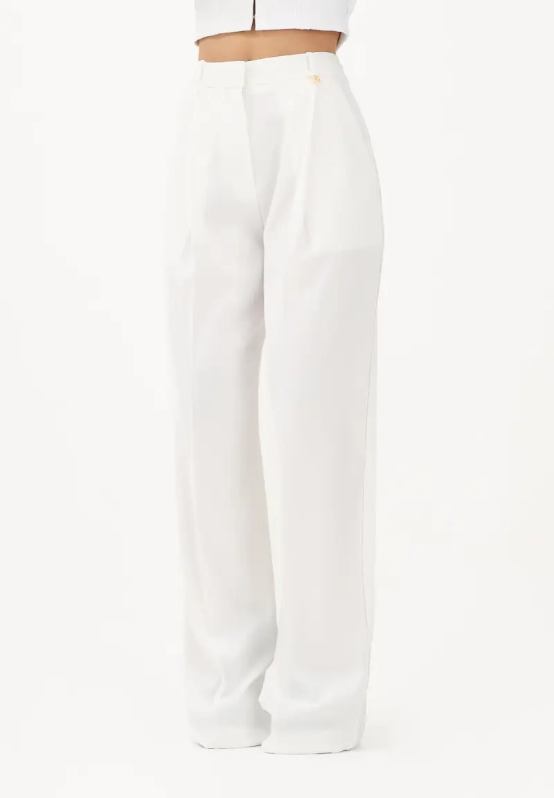 Pantalone elegante avorio da donna con logo charm