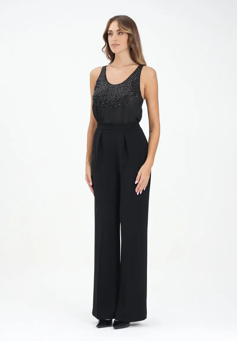 Tuta elegante nera da donna con corpetto ricoperto di strass