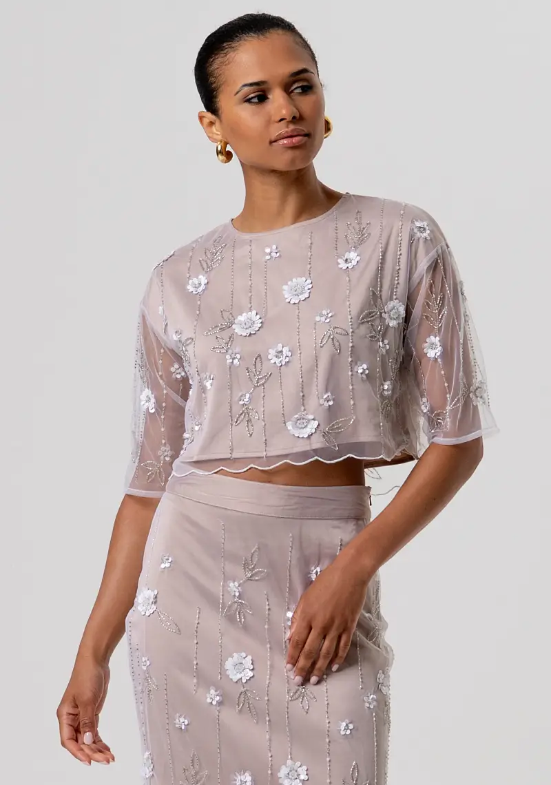 Top cropped in tulle con fiori e strass applicati