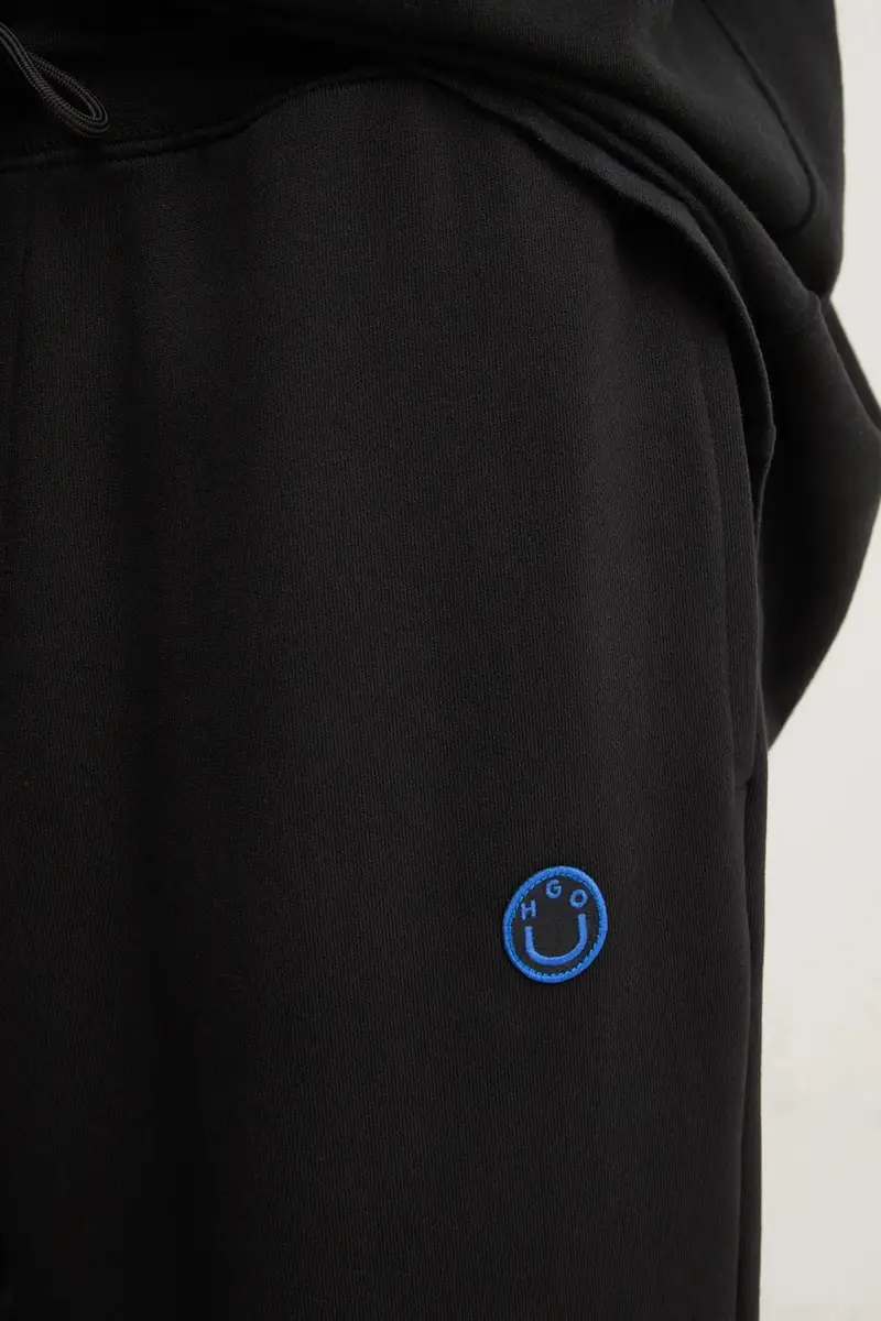 pantaloni della tuta di cotone colore nero 50522360 miniatura 4