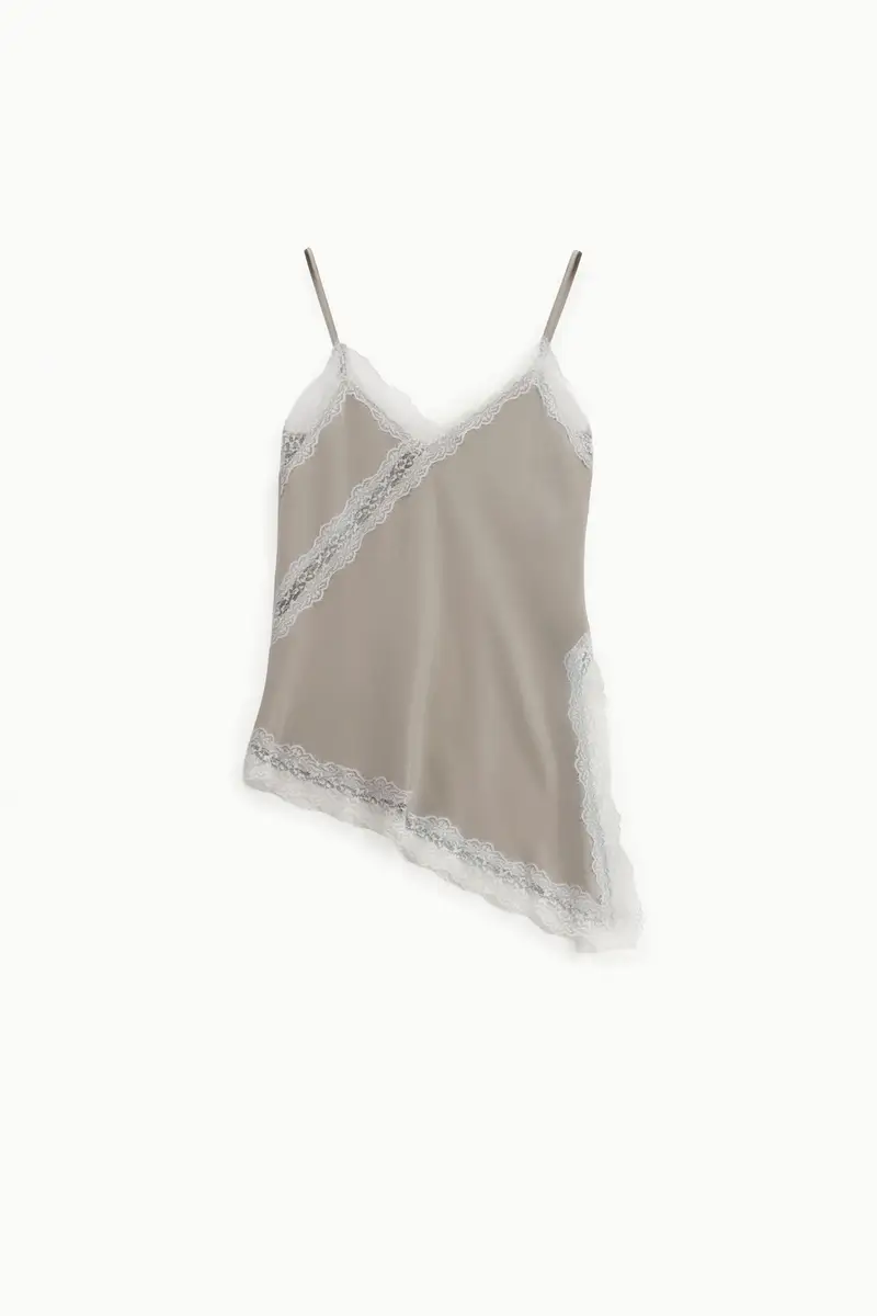 Top asimmetrico con pizzo e spalline sottili Platino