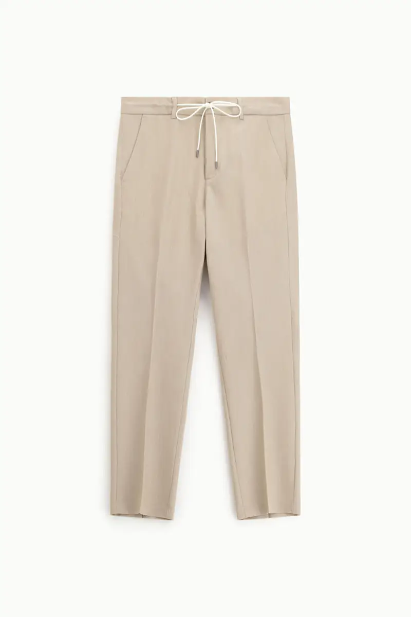 Trousers chino-fit con coulisse e piega frontale Beige