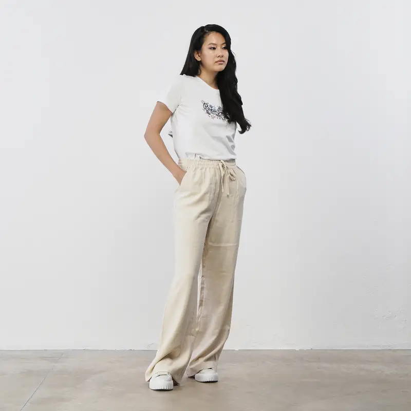 Pantaloni beige ampi da donna con coulisse in vita