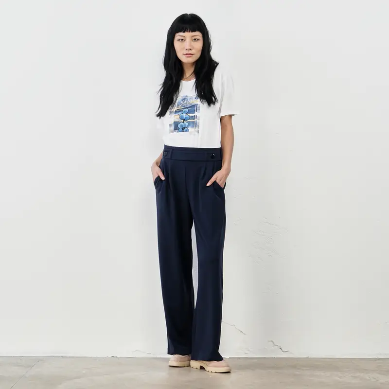 Pantaloni blu ampi con bottoni decorativi