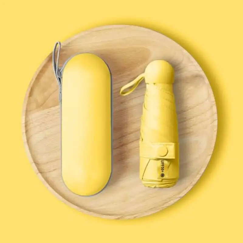 Kiuiom Pieghevole Ombrello da Viaggio, Portatile Compatto Ombrello, Umbrella Pioggia Antivento Anti UV, Mini Ombrello da Tasca 6 Costole Mini Ombrello Ultraleggero per Donne Uomini(Giallo) miniatura 2
