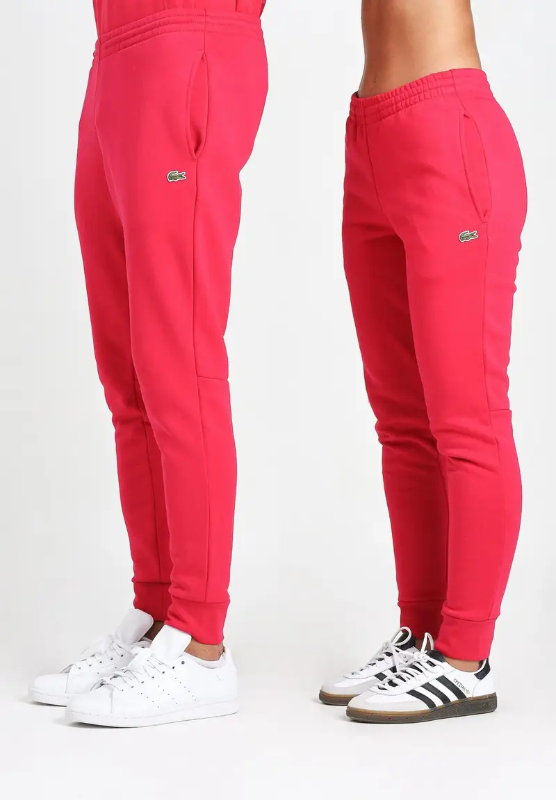 LACOSTE Pantalone sportivo color fragola per uomo e donna con logo