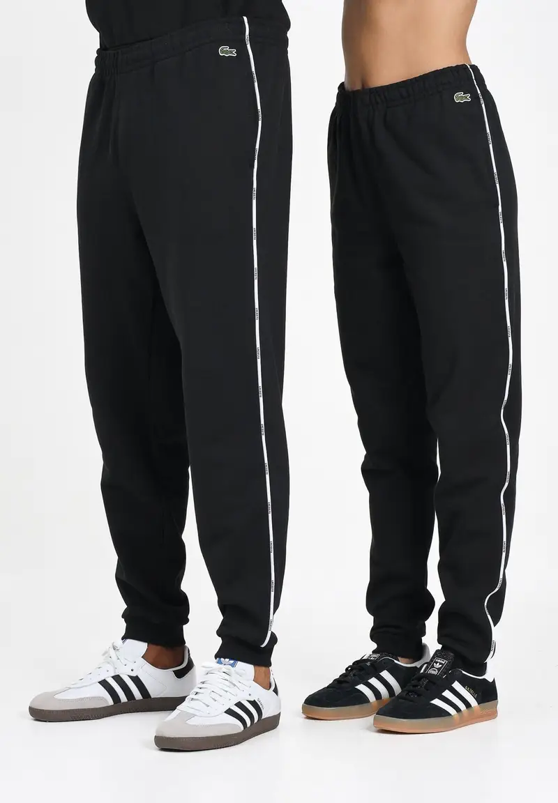 LACOSTE Pantalone sportivo nero per uomo e donna con riga logata
