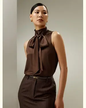 Top Senza Maniche Adatto A Molteplici Occasionifungo Gelso 100%. Fungo Gelso 100%. Disponibile In Cioccolato Petite