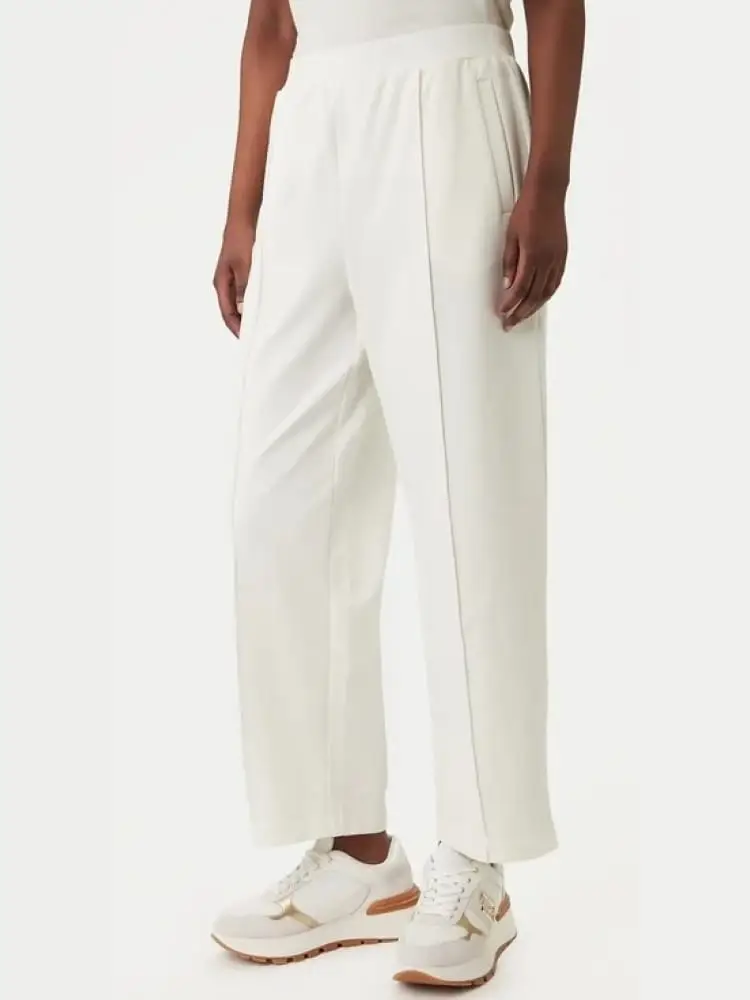 pantaloni donna bianchi con logo dorato