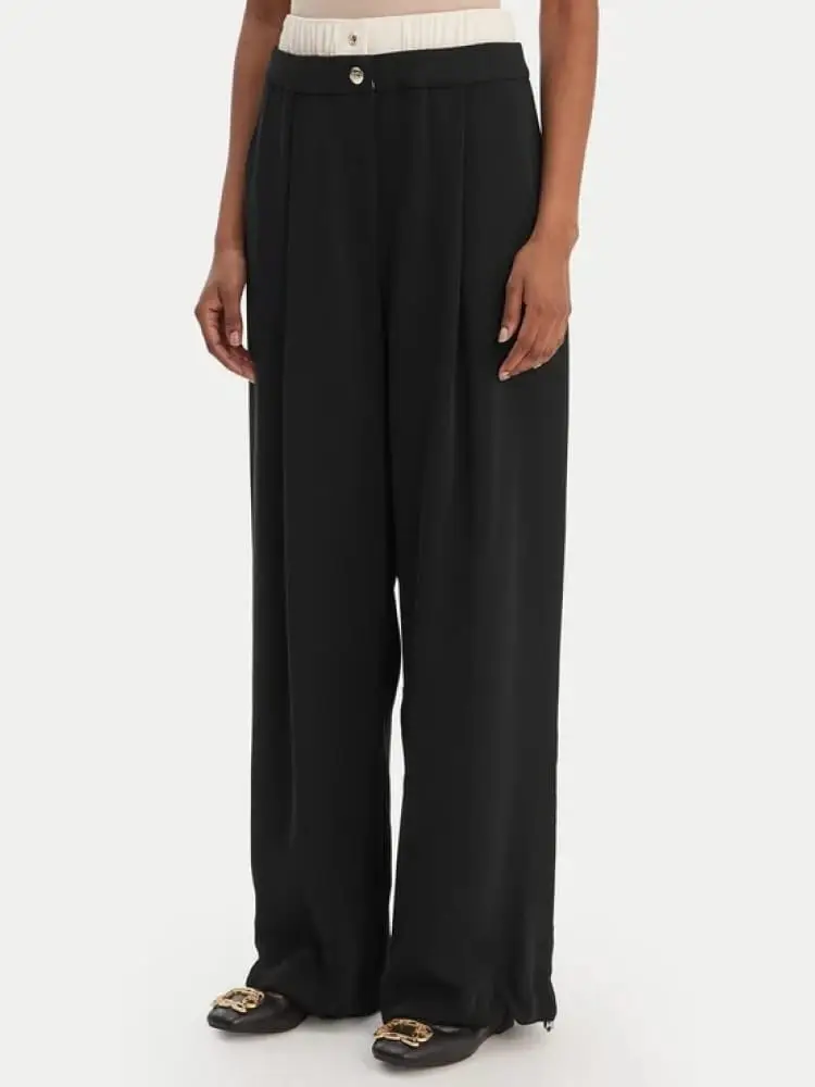 pantaloni donna neri lunghi con bottone logato