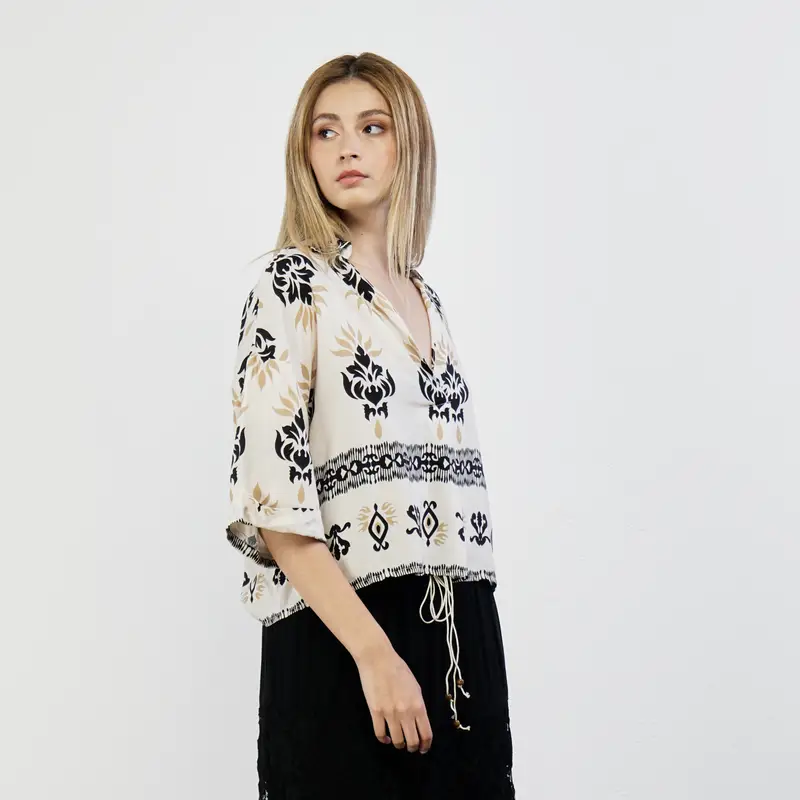 Blusa beige con stampa