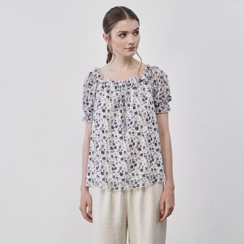 Blusa bianca e blu da donna in fantasia fiori con scollo con fiocchetto