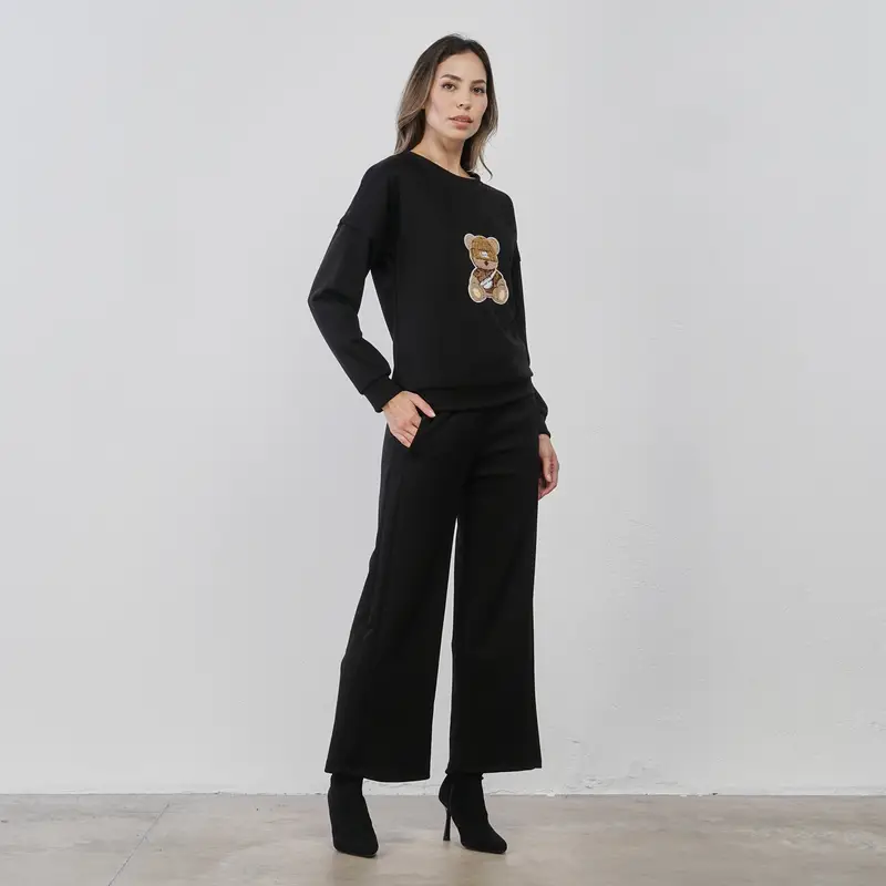 Pantaloni lunghi neri da donna con dettaglio orsetto