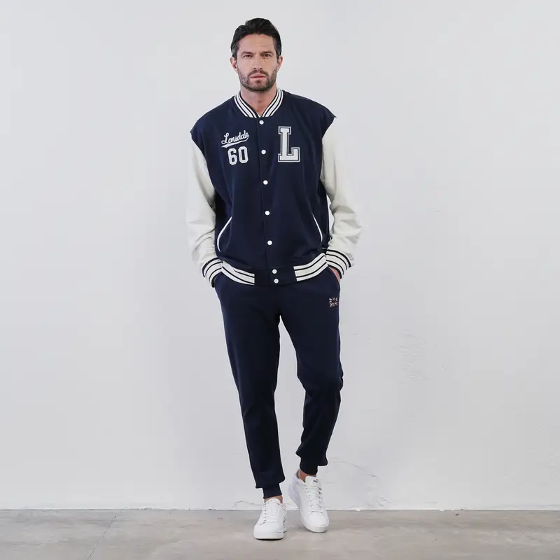 Pantaloni lunghi blu sportivi con tasche e polsini alla caviglia