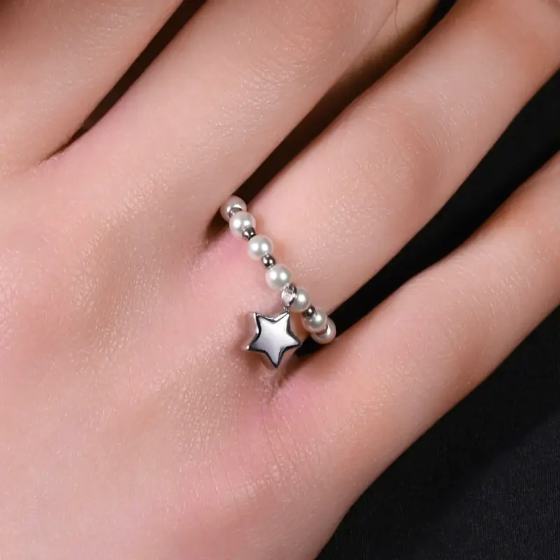 ANELLO DONNA IN ACCIAIO E PERLE SINTETICHE BIANCHE CON STELLA miniatura 2