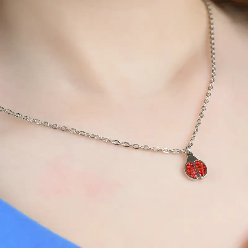 COLLANA BAMBINA IN ACCIAIO CON COCCINELLA E CRISTALLI ROSSI miniatura 2