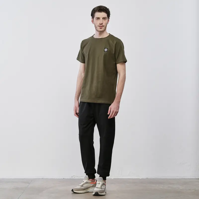 Pantaloni sportivi neri da uomo con polsini