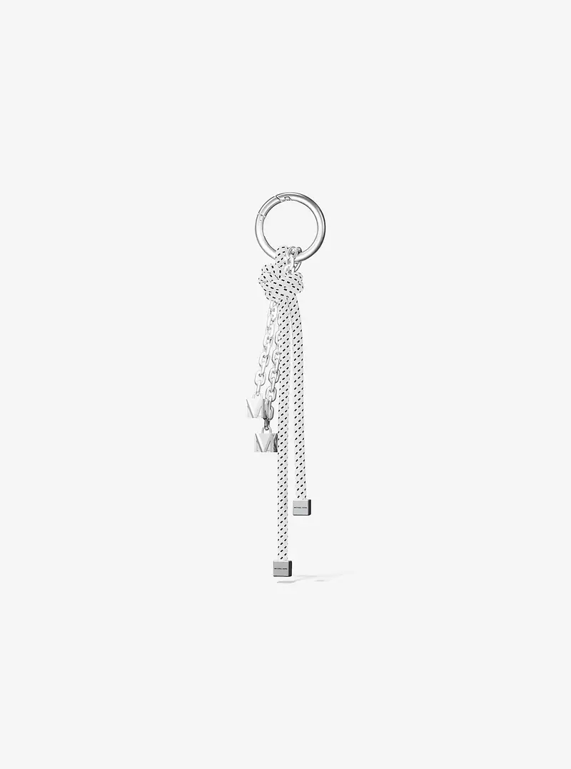 MK Ciondolo da borsa in tonalità argento con cordoncino maculato - Bianco - Michael Kors