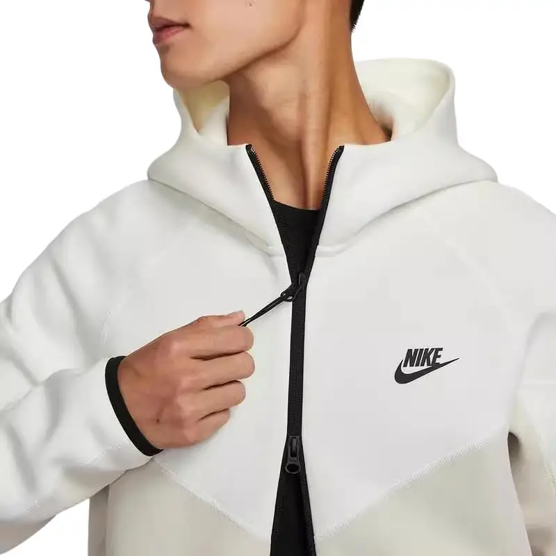 Felpa con Cappuccio Nike Tch Flc Fz Wr Color Block Comoda Giacca Casual Uomo giacche Kaki FB7922-104 L miniatura 2