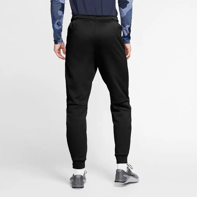 Pantaloni da Allenamento Nike Therma Tapered Swoosh Foderati in Pile Uomo Parte Inferiore Nero 932258-010 M miniatura 3