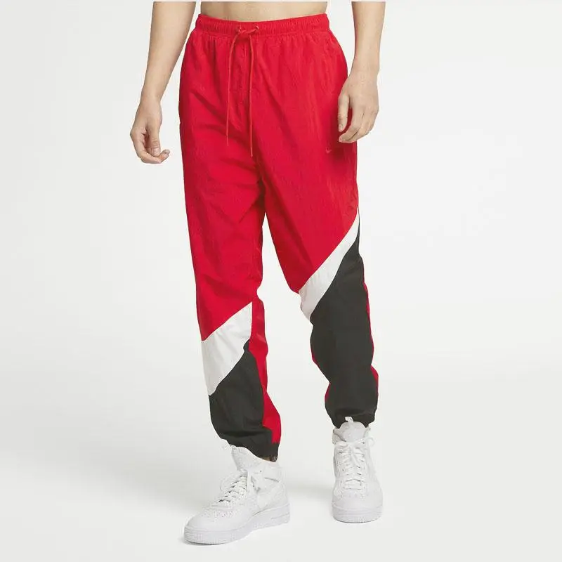 Nike Pantaloni da tuta lunghi larghi in maglia rossi con design miniatura 4