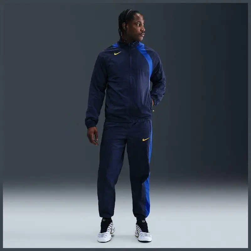 Pantaloni fitness da ginnastica Nike Total 90 Bleu