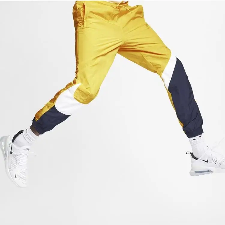 Pantaloni Sportivi Uomo Nike Retro Intrecciati Spliced Giallo AR9895-728 XXL miniatura 2