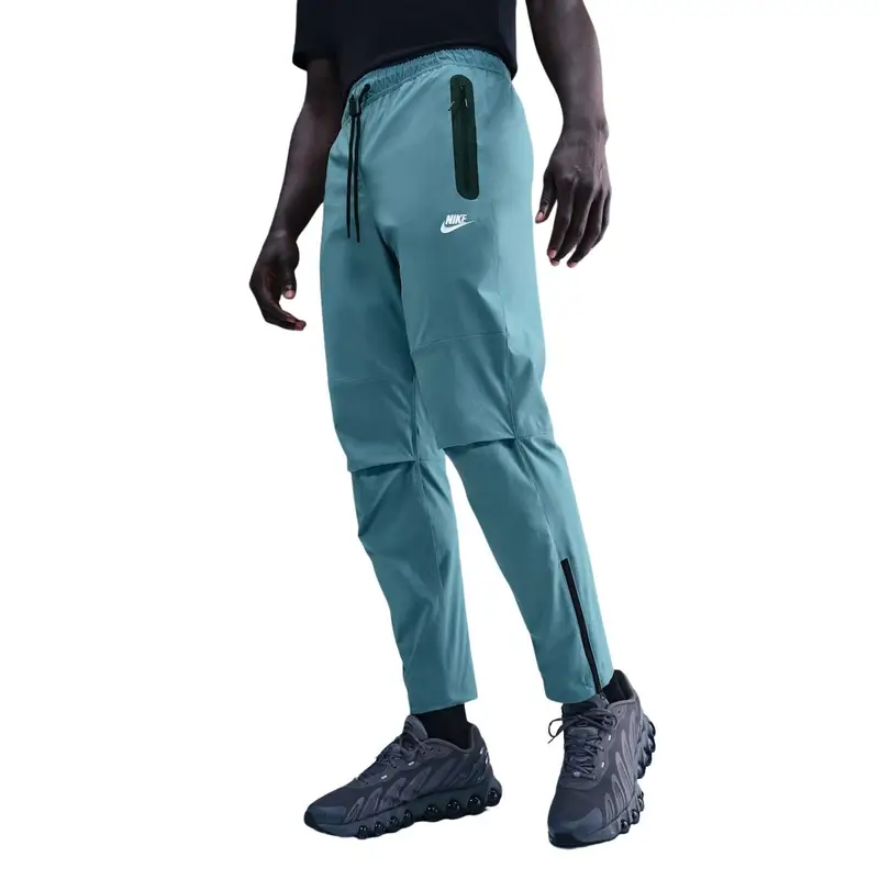 Pantaloni tissi con orlo aperto Nike Tech Bleu