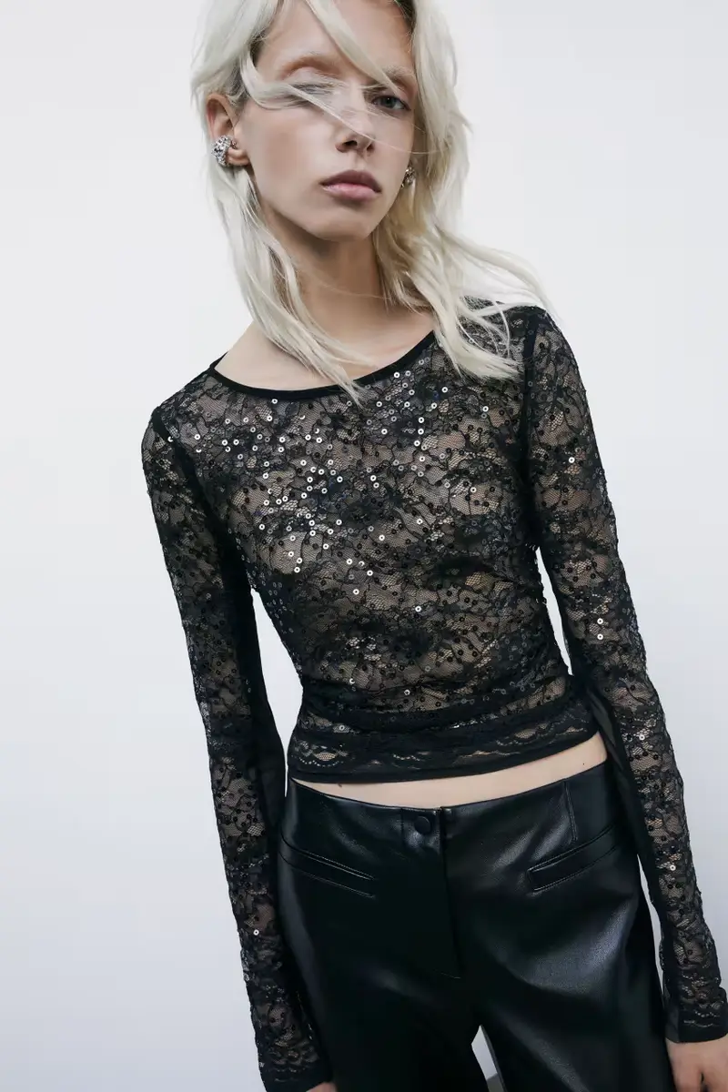 Top a maniche lunghe in pizzo con paillettes Nero