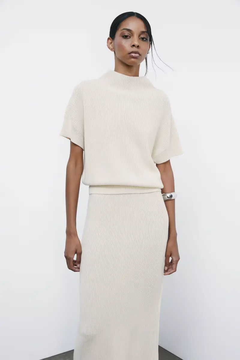 Top smanicato "ESSENTIAL" in maglia Bianco