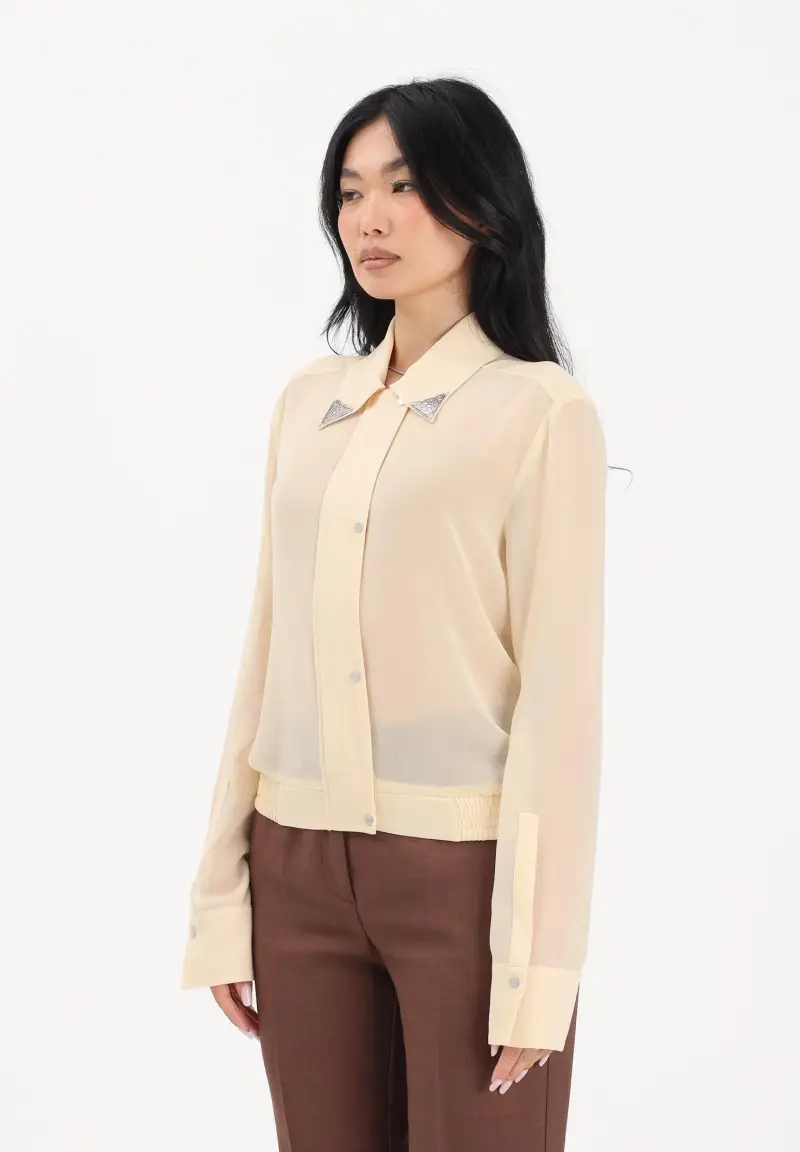 Camicia a manica lunga gialla da donna con dettagli metallici