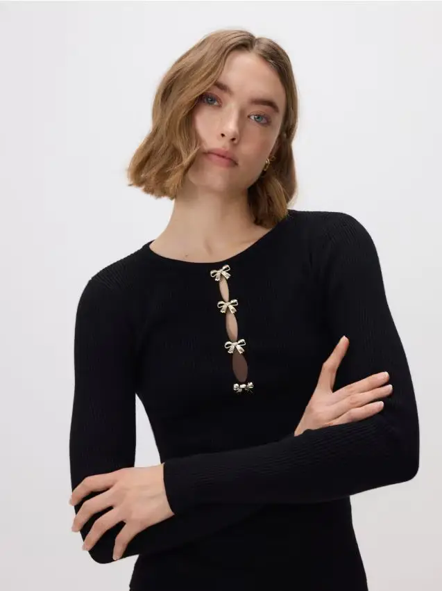 Blusa con applicazione decorativa - nero