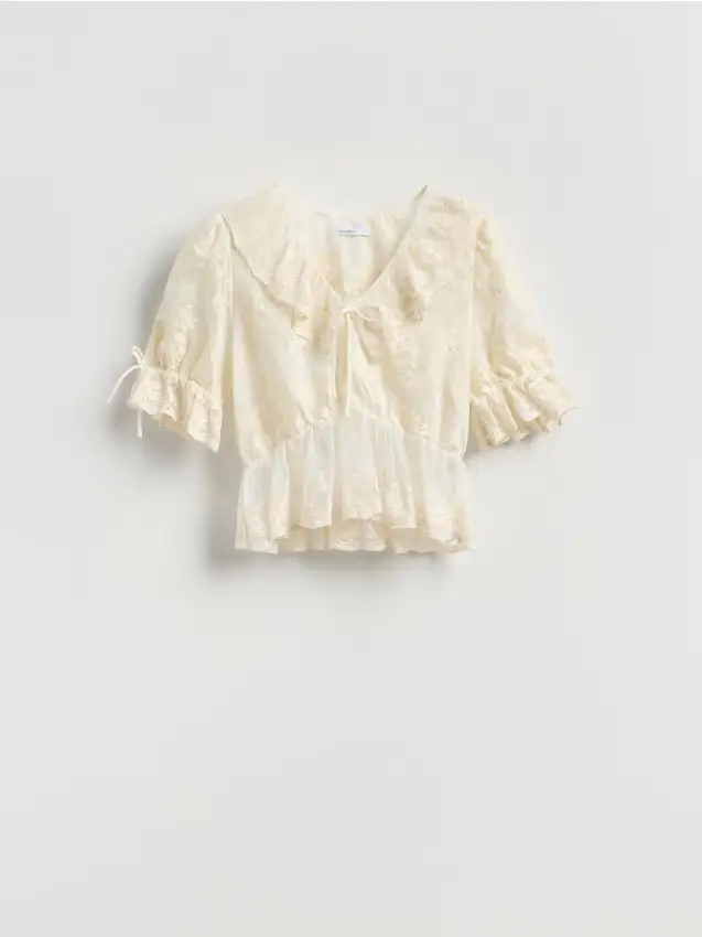 Blusa ricamata con peplo - panna