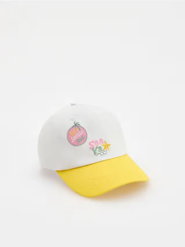 Cappello con visiera e ricamo - panna