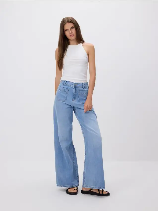 Jeans a gamba larga con tasche applicate - blu