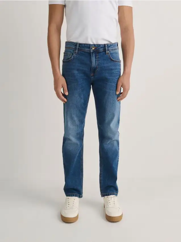 Jeans slim con effetto slavato - blu
